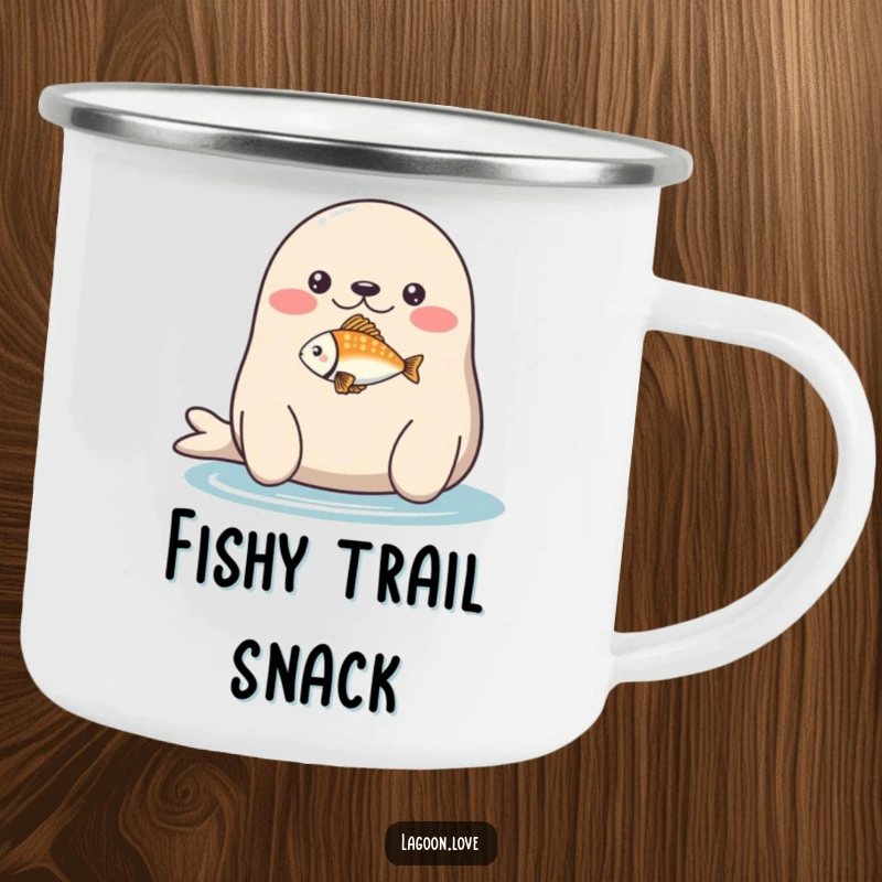 Funny camping mug: a plump, round seal balancing a tiny, brightly colored fish on its nose.