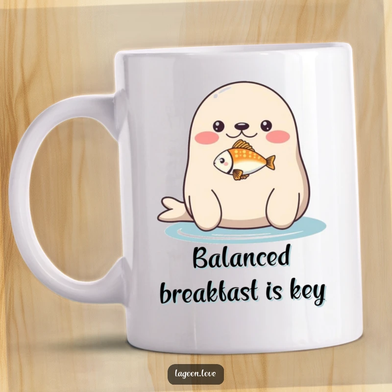 Funny mug: a plump, round seal with a happy expression balancing a tiny, brightly colored fish on its nose.