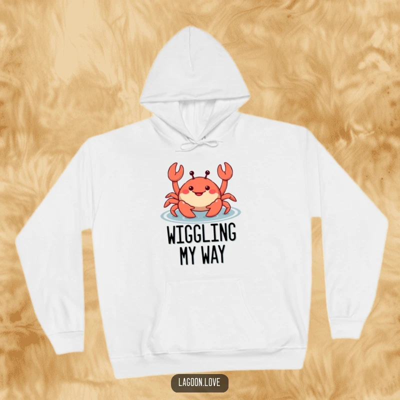 Funny smiling cartoon crab hoodie, wiggling its claws mischievously in shallow water, offering warmth and seaside charm.