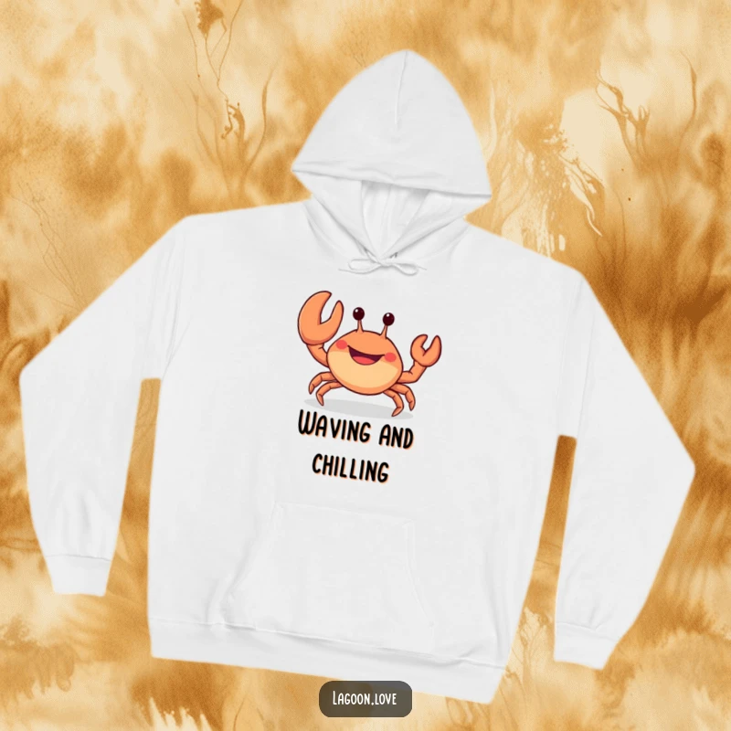 Funny hoodie: a stubby, cheerful crab with a wide grin waves a large claw, radiating happiness.